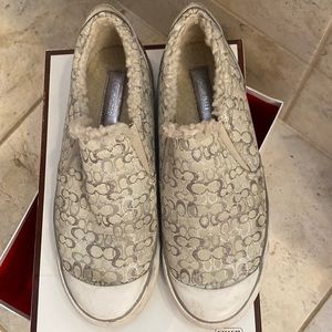 Coach slip on sneaker.  Silver, size 9. Includes original box.